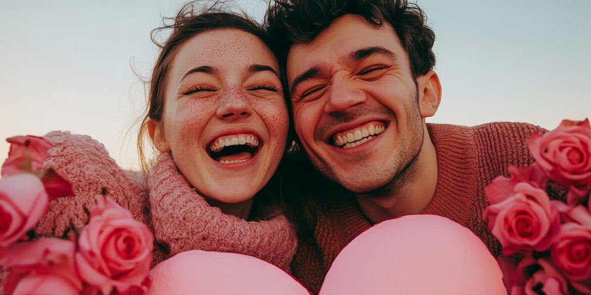 Gen Z couple smiling with pink hearts and roses